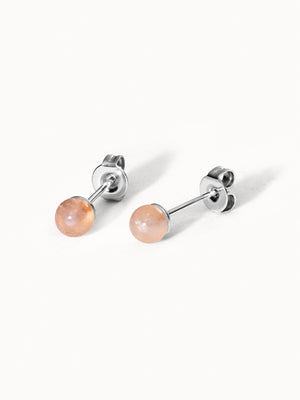 Silberne Ohrringe mit rosafarbenen Steinen, elegant und modern, von PURELEI.