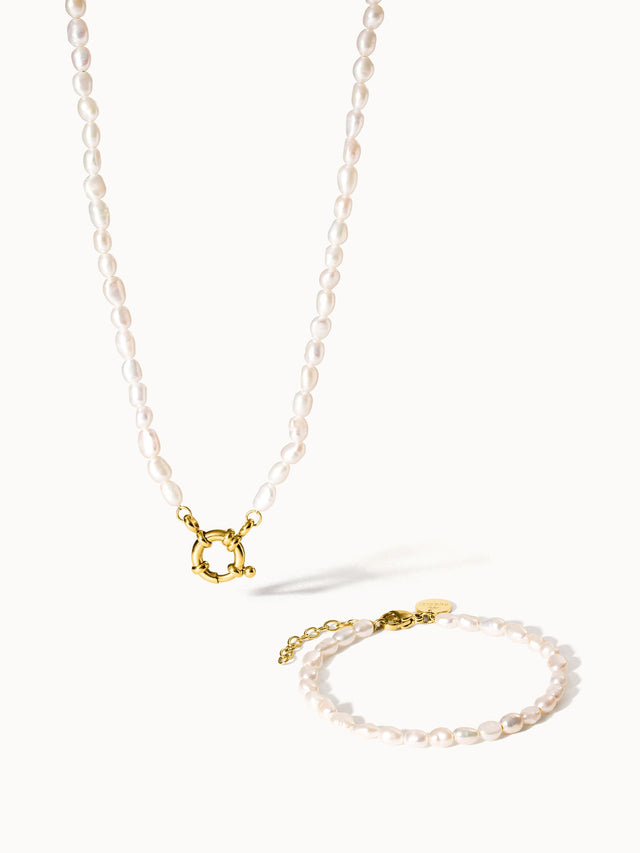 Perlenkette und Armband in zartem Rosa mit goldenen Akzenten von PURELEI.